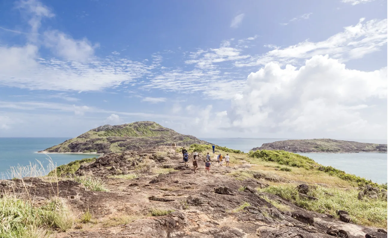 Photo of a rocky outcrop with sea in the background at Bamaga.